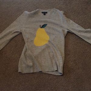 Light grey sweater with a yellow pear design.